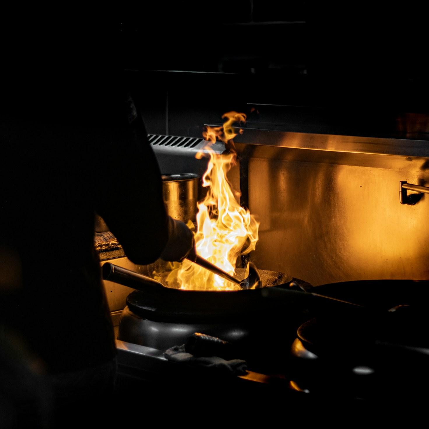 Community members working together in a modern kitchen, exchanging recipes and techniques